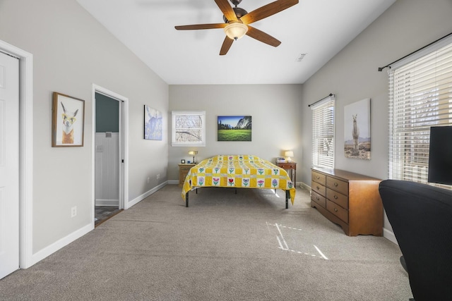 bedroom featuring ceiling fan and carpet