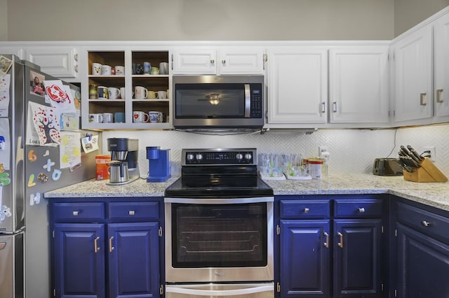 kitchen featuring white cabinets, backsplash, stainless steel appliances, light stone countertops, and blue cabinetry