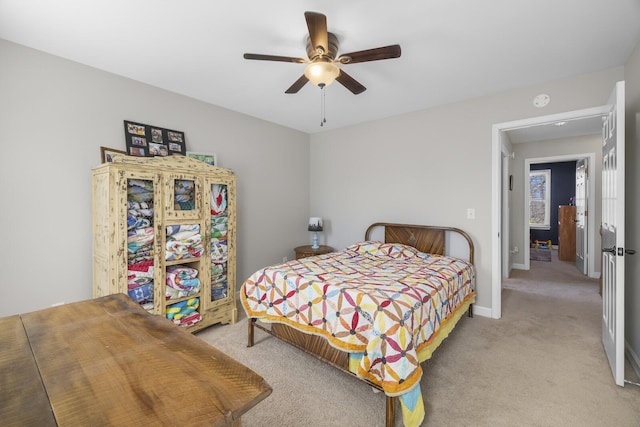 bedroom with light colored carpet and ceiling fan