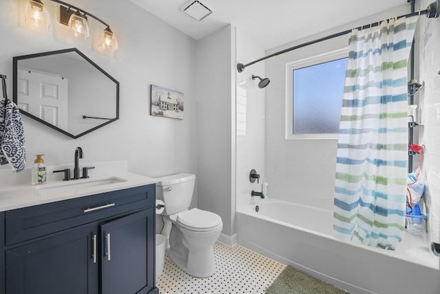 full bathroom with shower / tub combo with curtain, vanity, and toilet