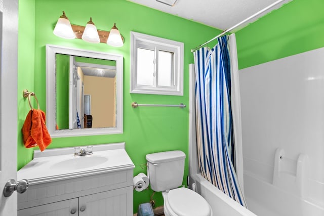 full bathroom featuring toilet, vanity, and shower / bathtub combination with curtain