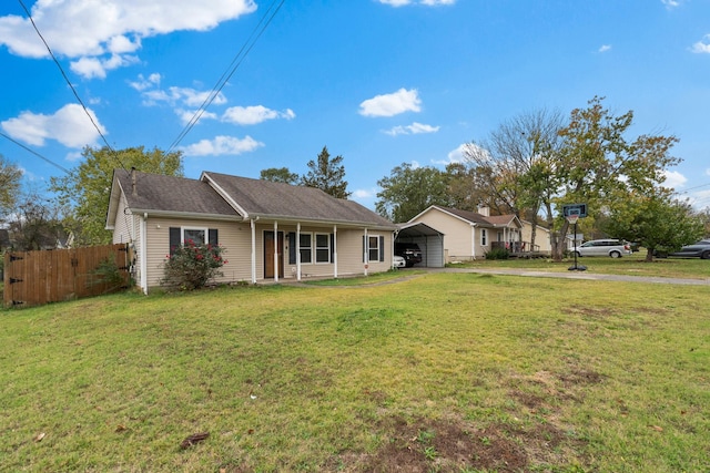 view of front of home with a carport and a front yard