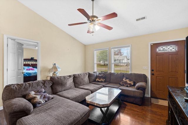 living room with lofted ceiling, dark wood-type flooring, and ceiling fan