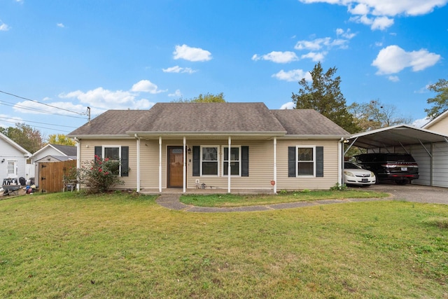 view of front of home with a front lawn, a carport, and covered porch