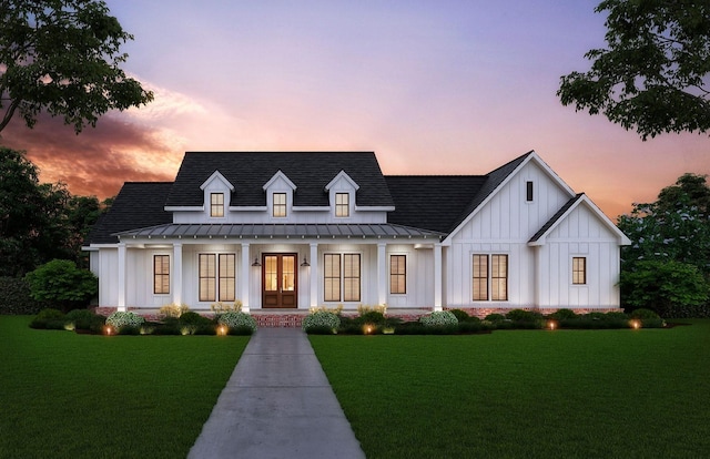 view of front facade featuring a porch and a lawn