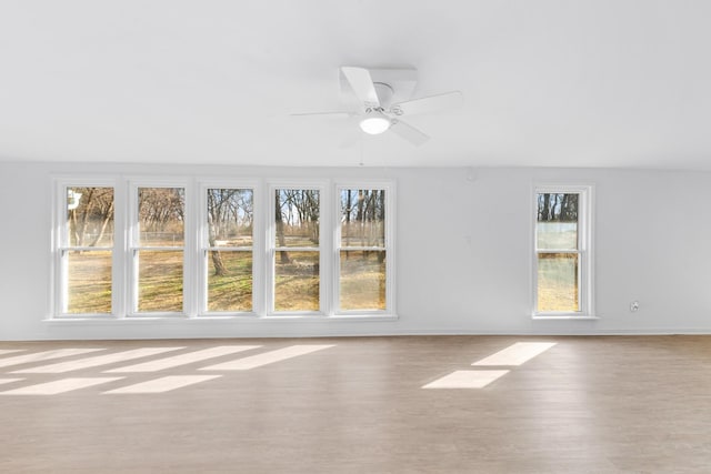 interior space featuring light hardwood / wood-style flooring and ceiling fan