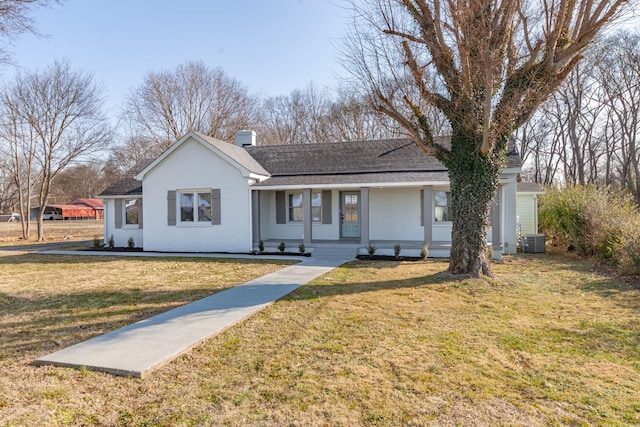 single story home featuring covered porch, a front yard, and central air condition unit