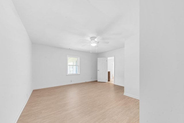 spare room with light hardwood / wood-style flooring and ceiling fan