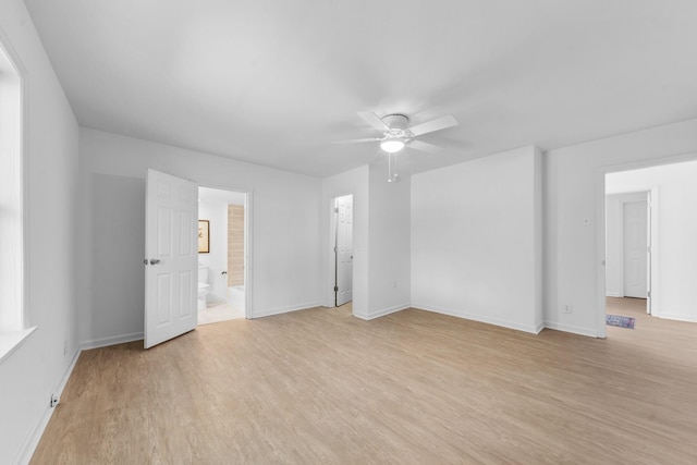 spare room featuring ceiling fan and light hardwood / wood-style flooring