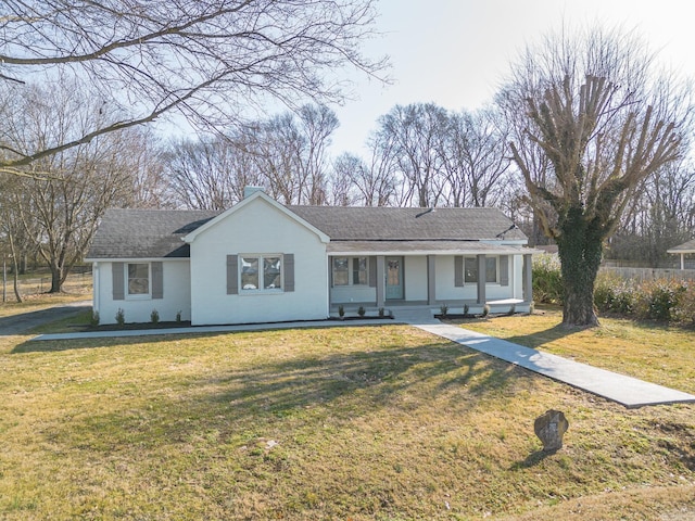 ranch-style house featuring a front yard