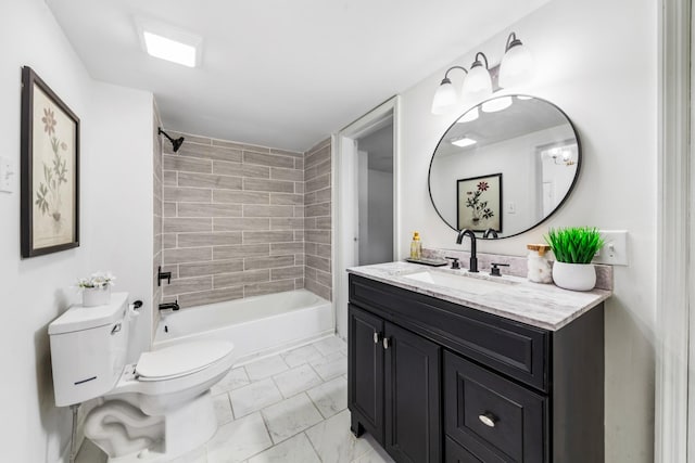 full bathroom featuring vanity, toilet, and tiled shower / bath