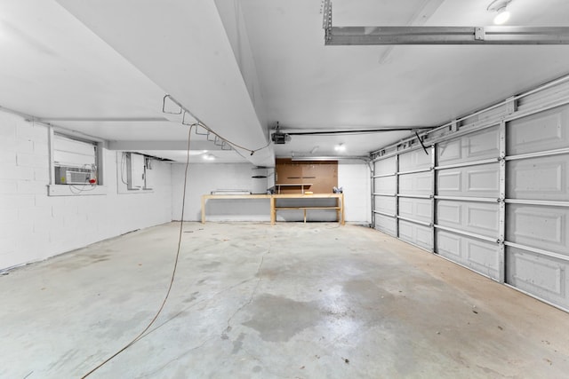 garage featuring a garage door opener and cooling unit