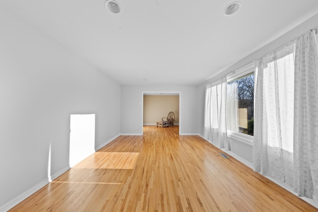 spare room featuring light hardwood / wood-style flooring