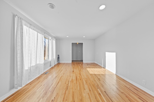 spare room with light hardwood / wood-style floors