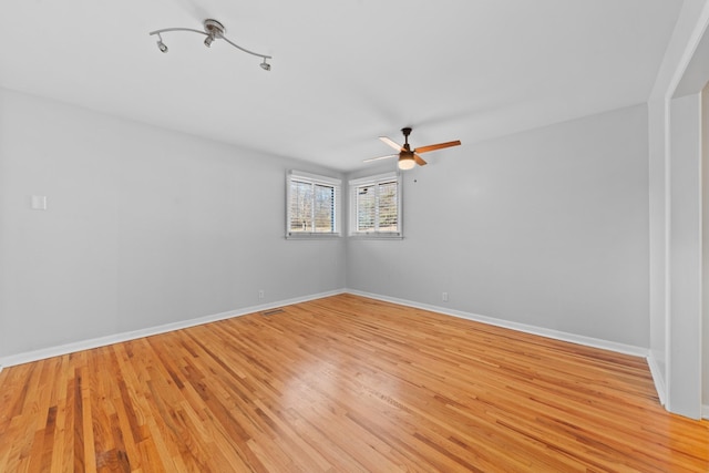 unfurnished room with ceiling fan and light hardwood / wood-style floors