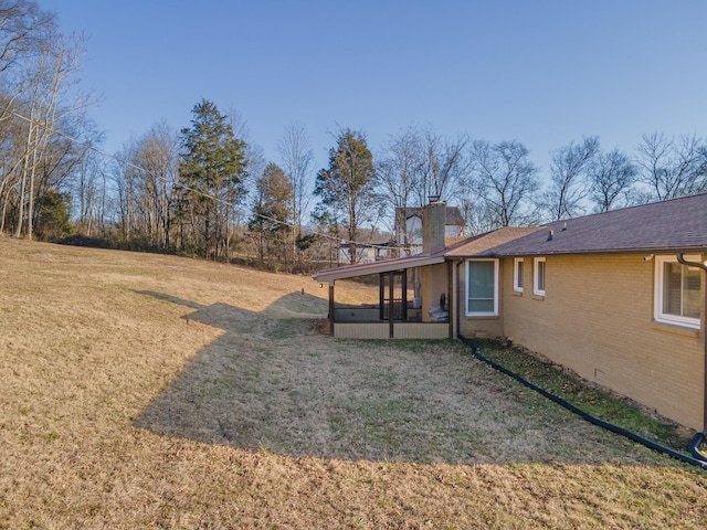 view of yard featuring a sunroom