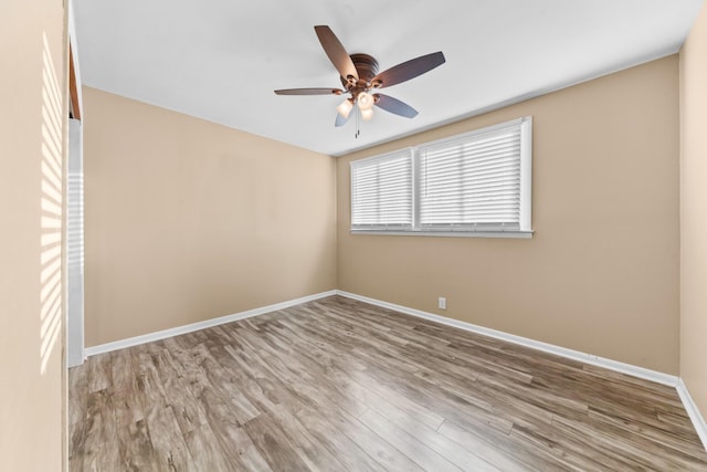 spare room with ceiling fan and light hardwood / wood-style floors