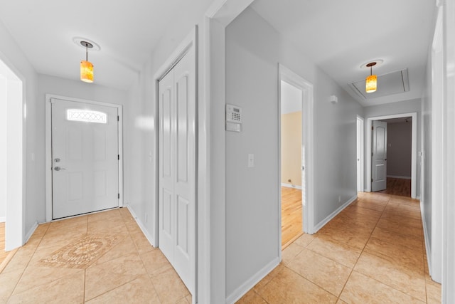 hallway with light tile patterned floors