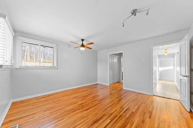 interior space featuring ceiling fan and light wood-type flooring