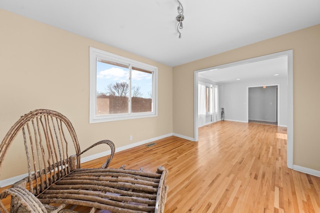 sitting room with light hardwood / wood-style floors