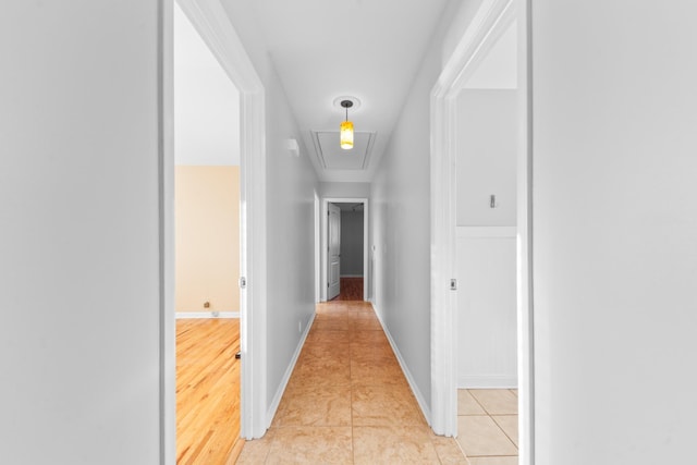 hallway featuring light tile patterned flooring