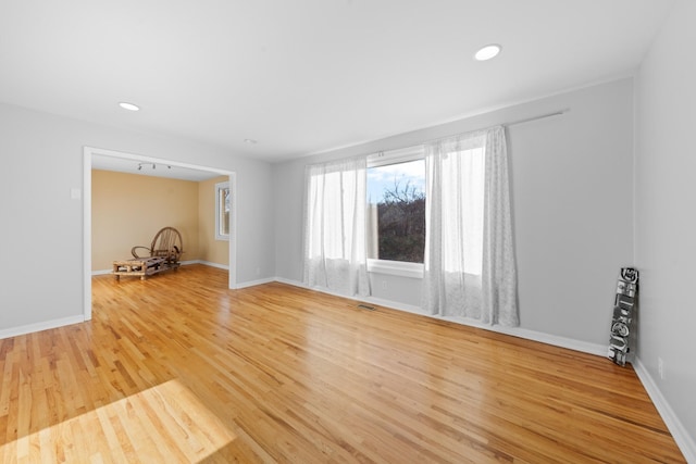 unfurnished living room with light hardwood / wood-style flooring