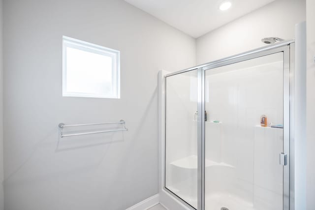 bathroom featuring an enclosed shower