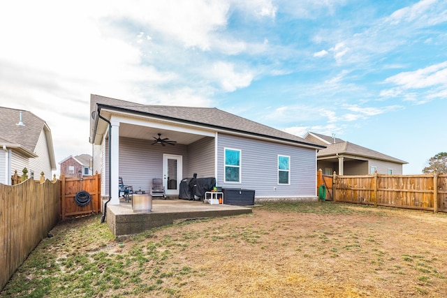 back of house featuring a yard, central AC, a patio, and ceiling fan