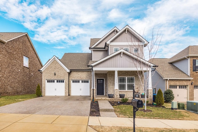 craftsman-style house featuring a garage and a porch