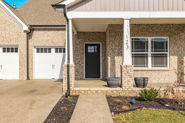 doorway to property with a garage