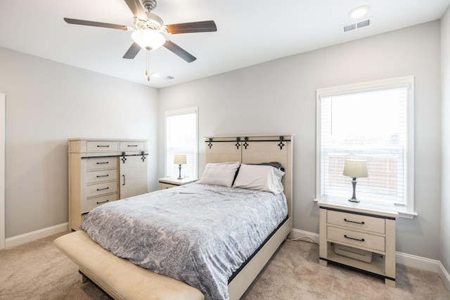 carpeted bedroom featuring ceiling fan