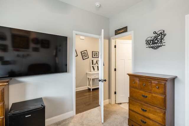 bedroom with light colored carpet