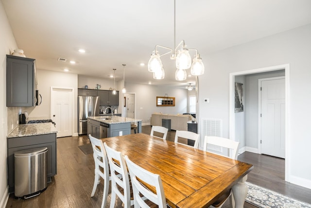 dining room featuring dark hardwood / wood-style floors and sink