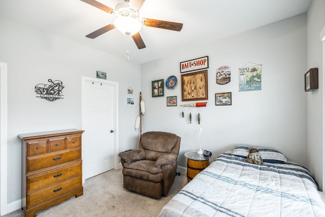 bedroom featuring light carpet and ceiling fan