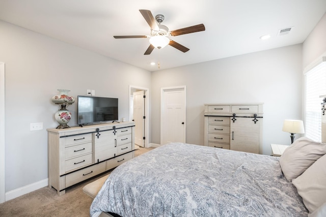 carpeted bedroom featuring ceiling fan