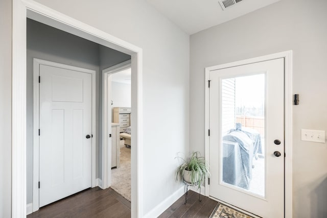 doorway to outside with dark hardwood / wood-style flooring