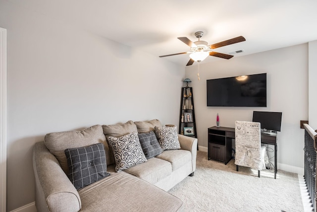 carpeted living room with ceiling fan