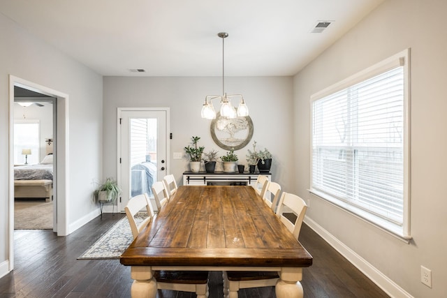 dining room with dark wood-type flooring