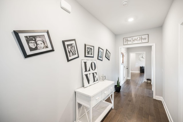 hallway with dark wood-type flooring