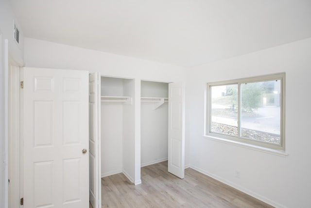 unfurnished bedroom with light hardwood / wood-style flooring