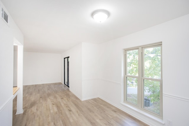 spare room featuring light wood-type flooring