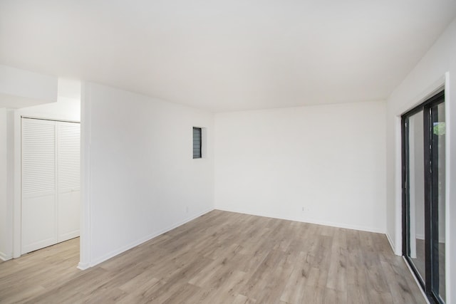 spare room with light wood-type flooring