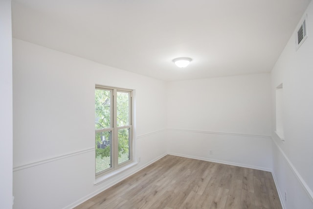 unfurnished room featuring light hardwood / wood-style flooring