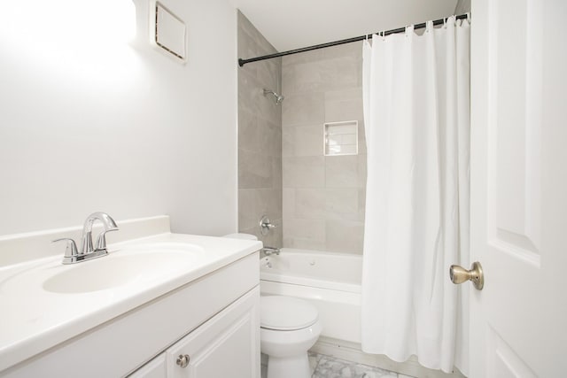 full bathroom with shower / tub combo with curtain, vanity, and toilet