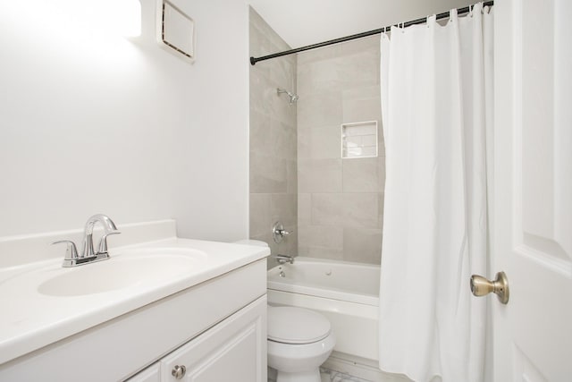 full bathroom with vanity, toilet, and shower / bath combo with shower curtain