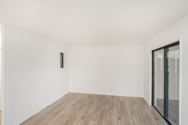 spare room featuring light hardwood / wood-style floors