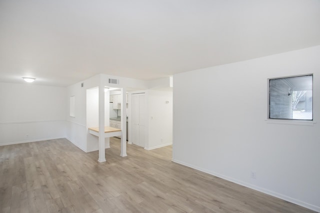 basement featuring light wood-type flooring