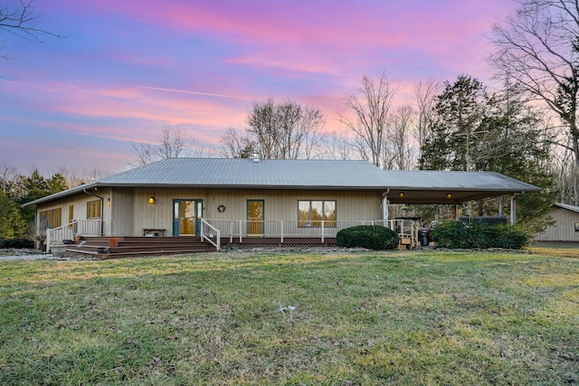 single story home featuring a yard and a deck