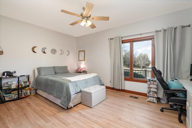 bedroom with ceiling fan and light wood-type flooring