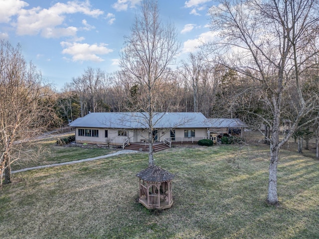 ranch-style home featuring a front yard